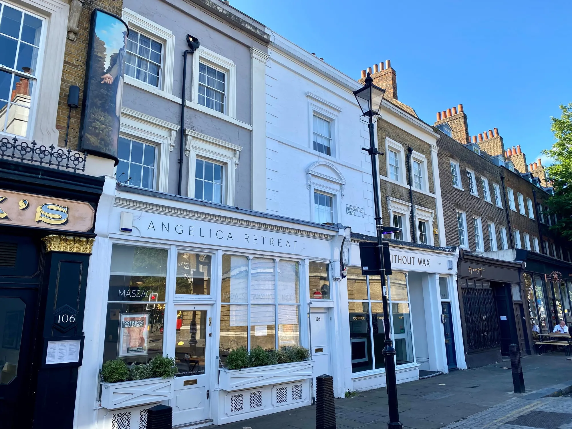 Georgian shopfronts and independent businesses on Islington High Street near the Angel