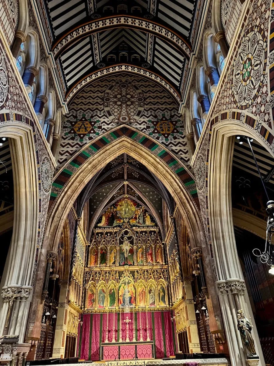 The richly patterned Gothic interior of All Saints, Margaret Street, with a gilded reredos above the altar