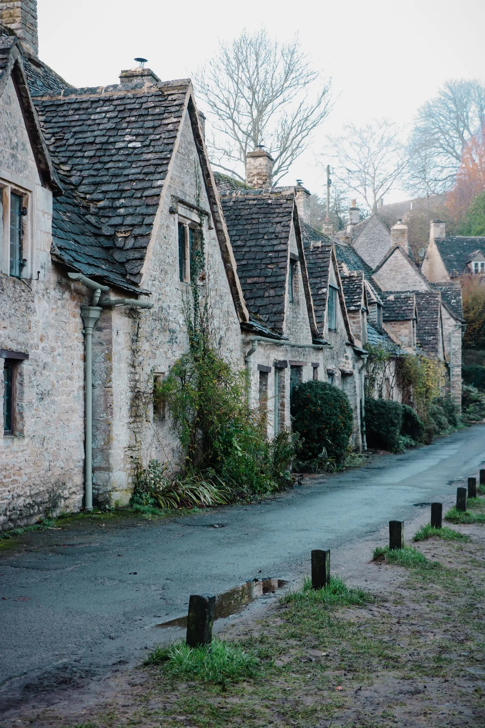 Arlington Row at Bibury: a terrace of steep-gabled stone weavers' cottages along a narrow lane