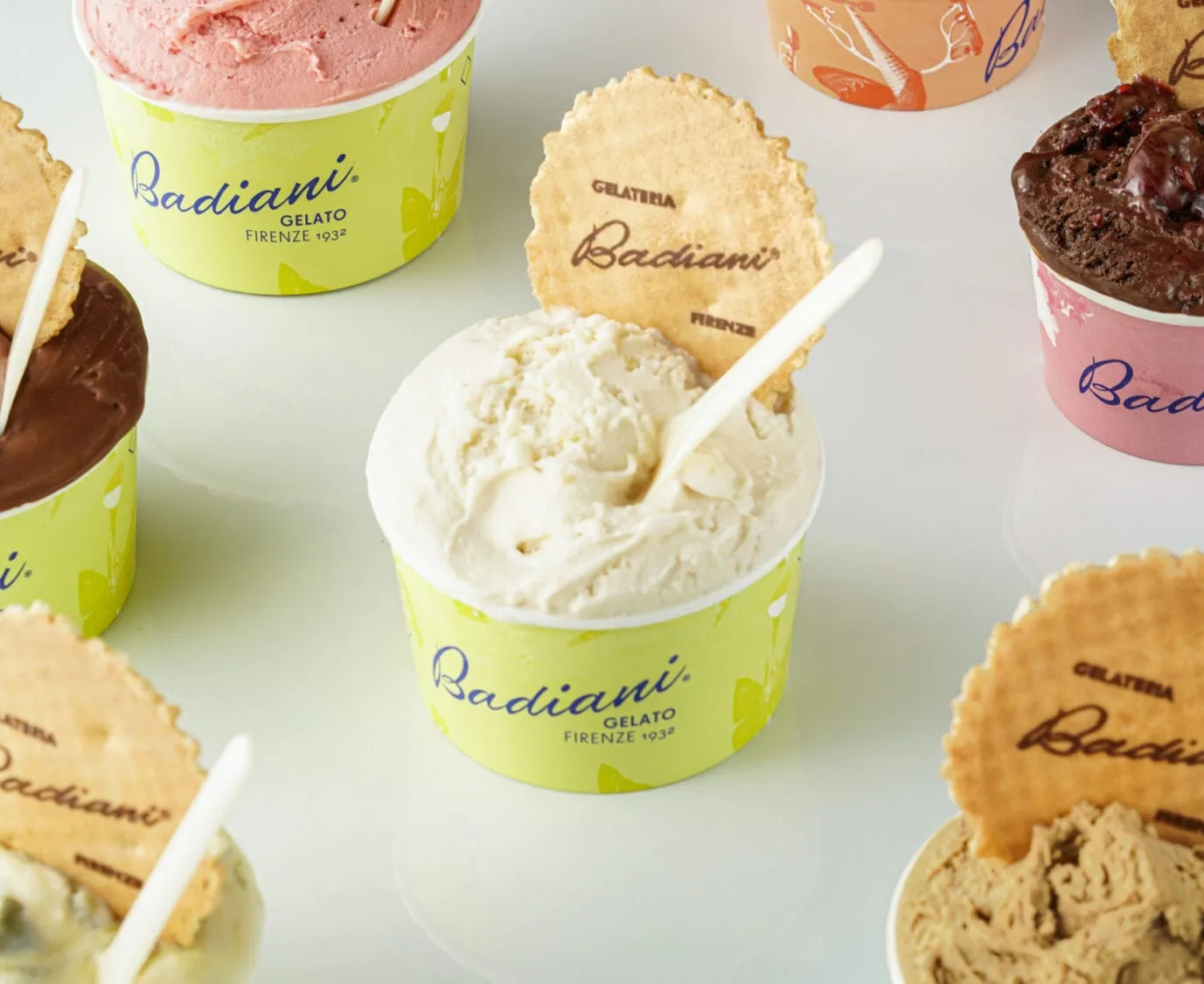 Badiani tubs of gelato with branded wafer discs, the pale cream Buontalenti in the centre of the group