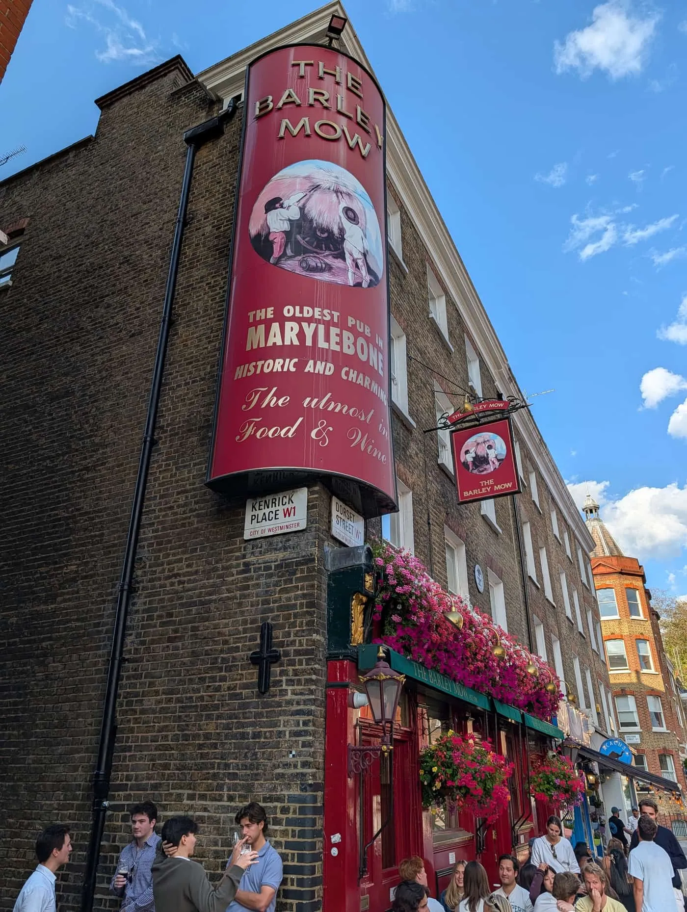 The Barley Mow pub on Dorset Street, its frontage hung with flowers and a painted sign reading the oldest pub in Marylebone