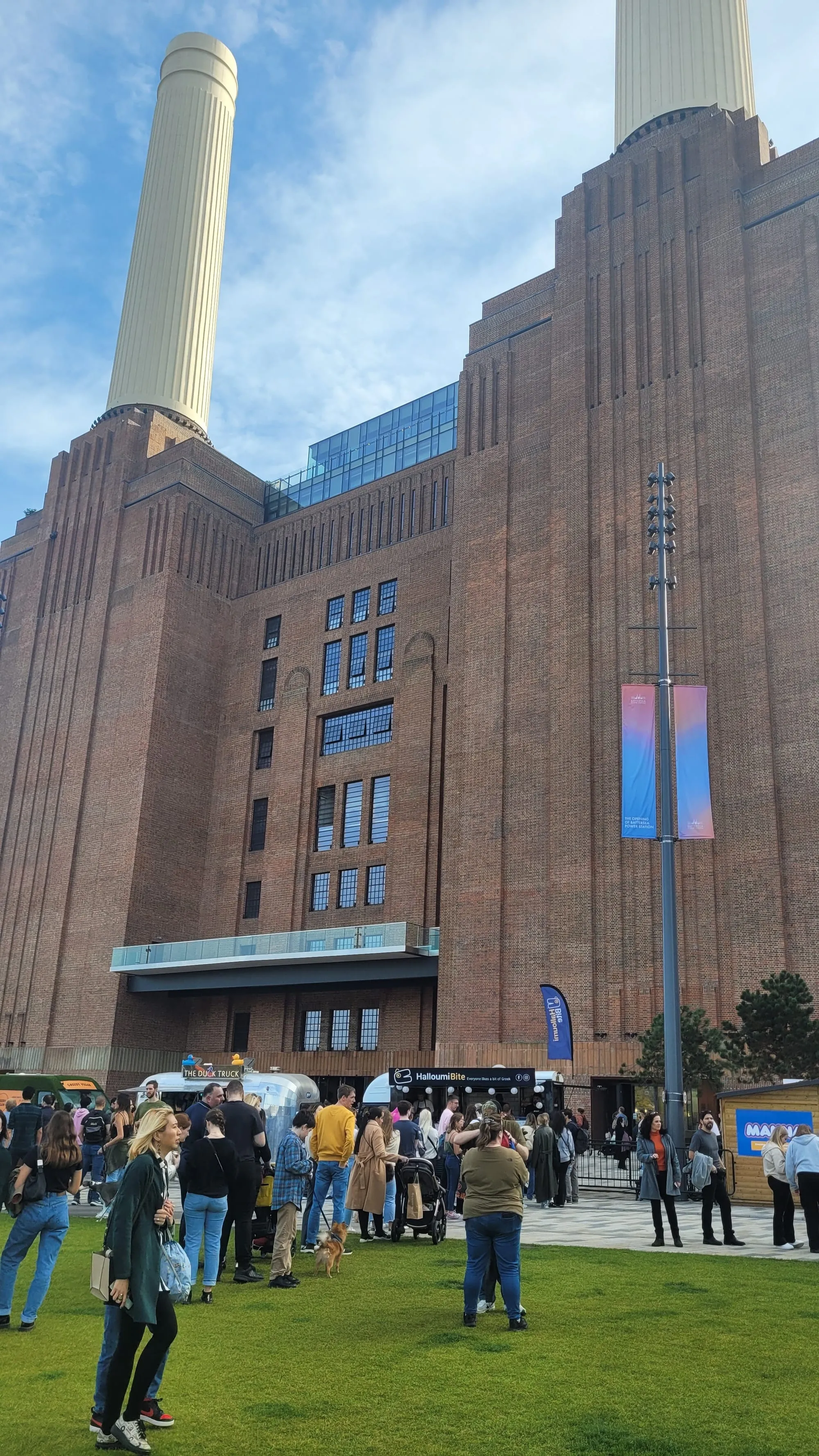 The brick facade and white chimneys of Battersea Power Station