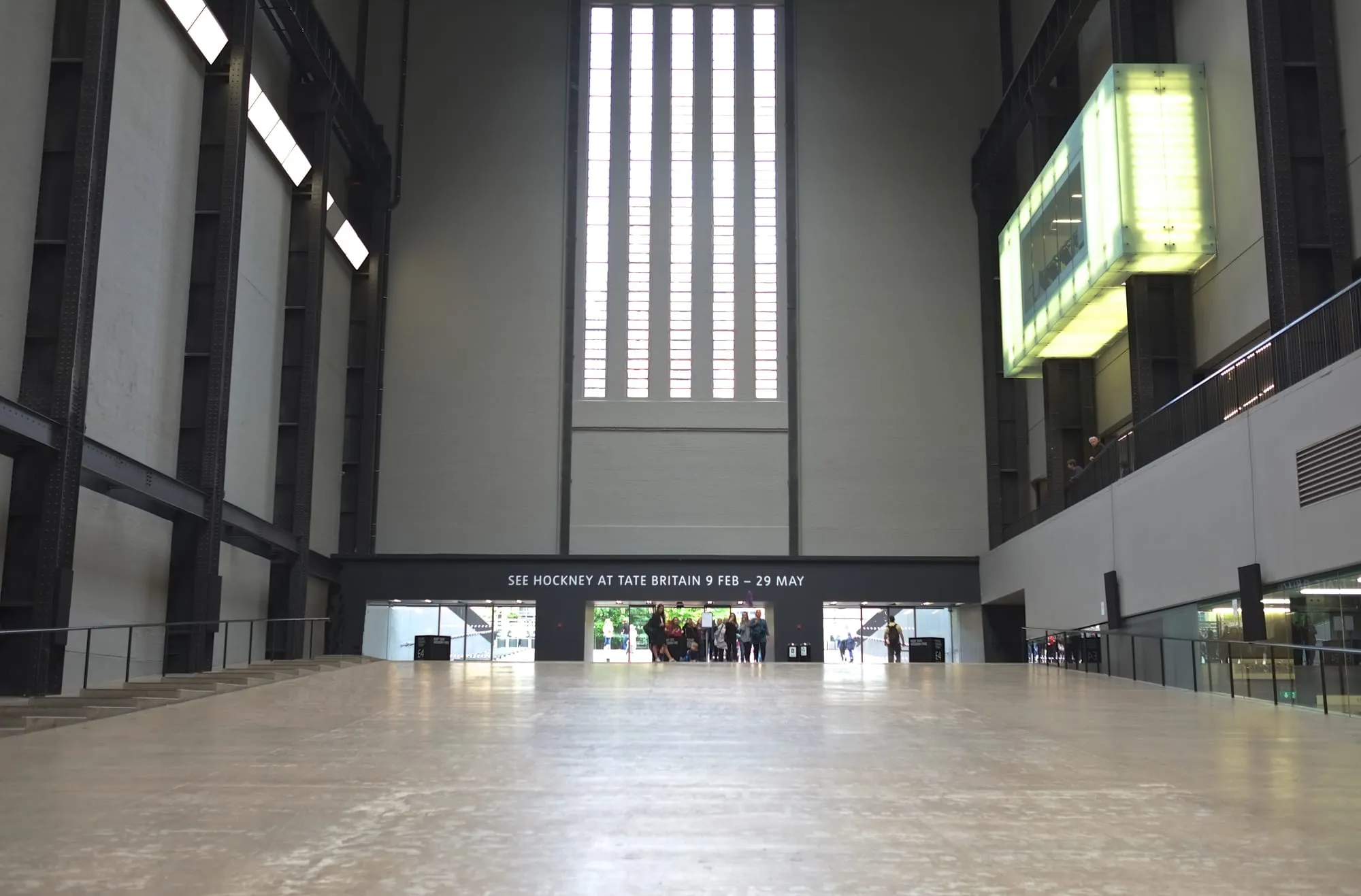 The vast Turbine Hall at Tate Modern, with visitors dwarfed by the space
