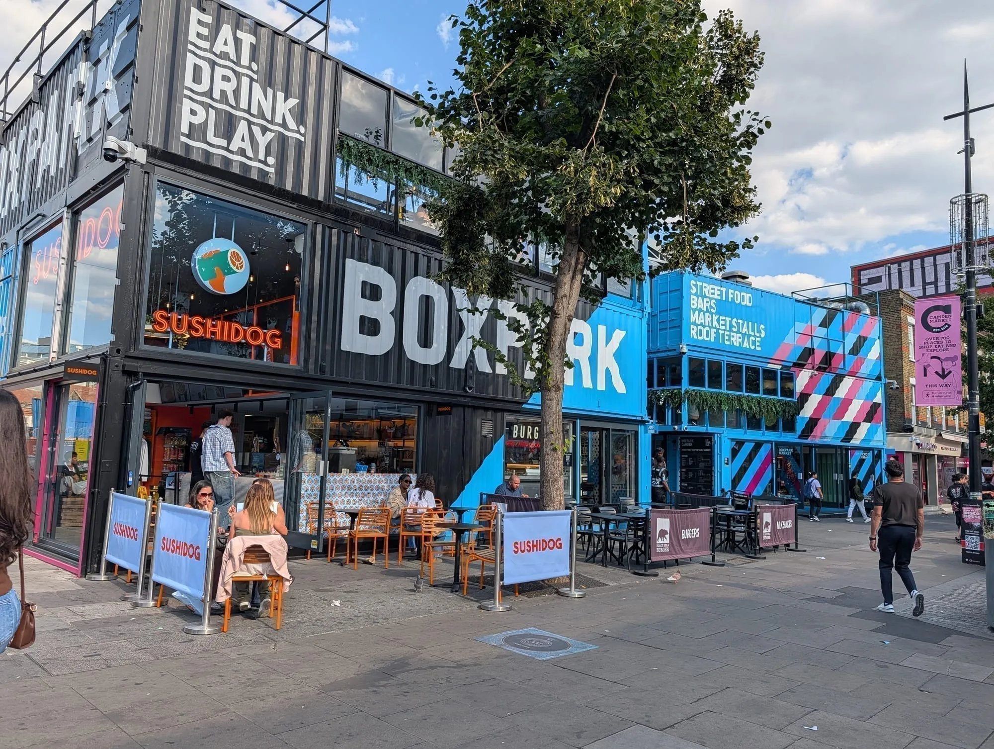 The BOXPARK Camden building, made of stacked shipping containers lettered Eat Drink Play