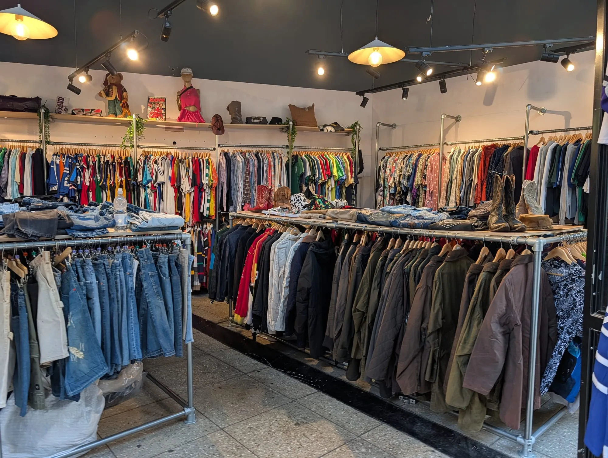 Rails of vintage clothing at a Camden market stall