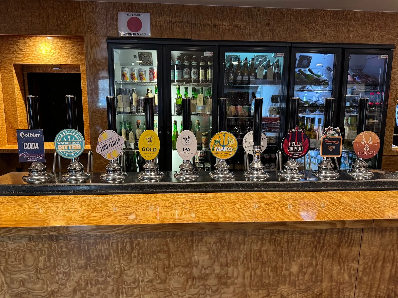 Ten handpumps in a row along the bar at Cask Pub & Kitchen, Pimlico