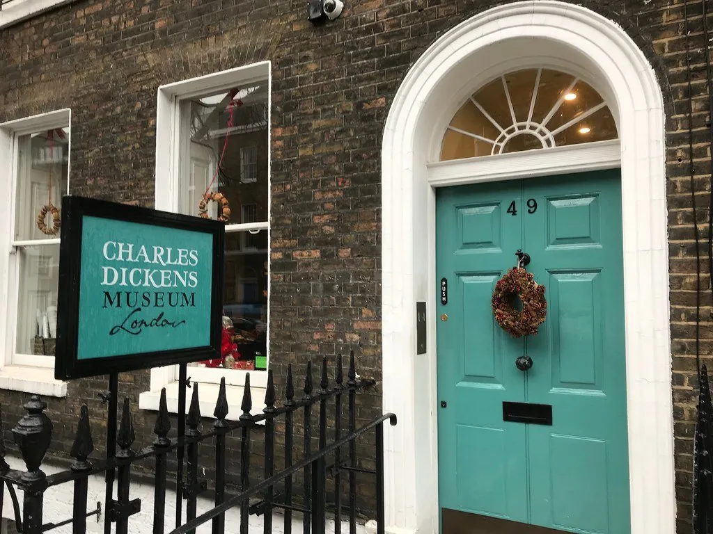 The green front door and museum sign of the Charles Dickens Museum on Doughty Street