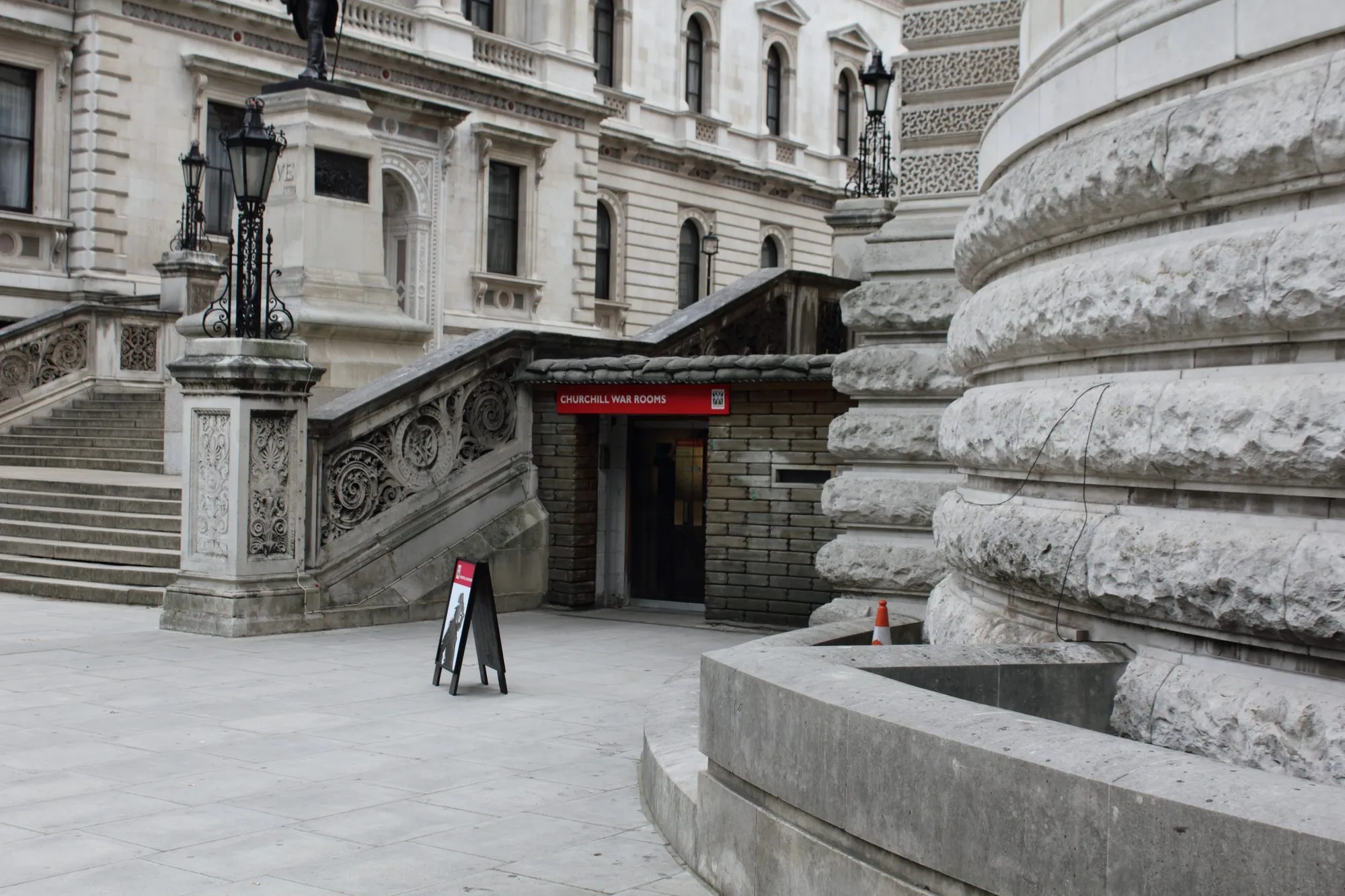 The Clive Steps entrance to the Churchill War Rooms on King Charles Street with blast wall and red entrance sign