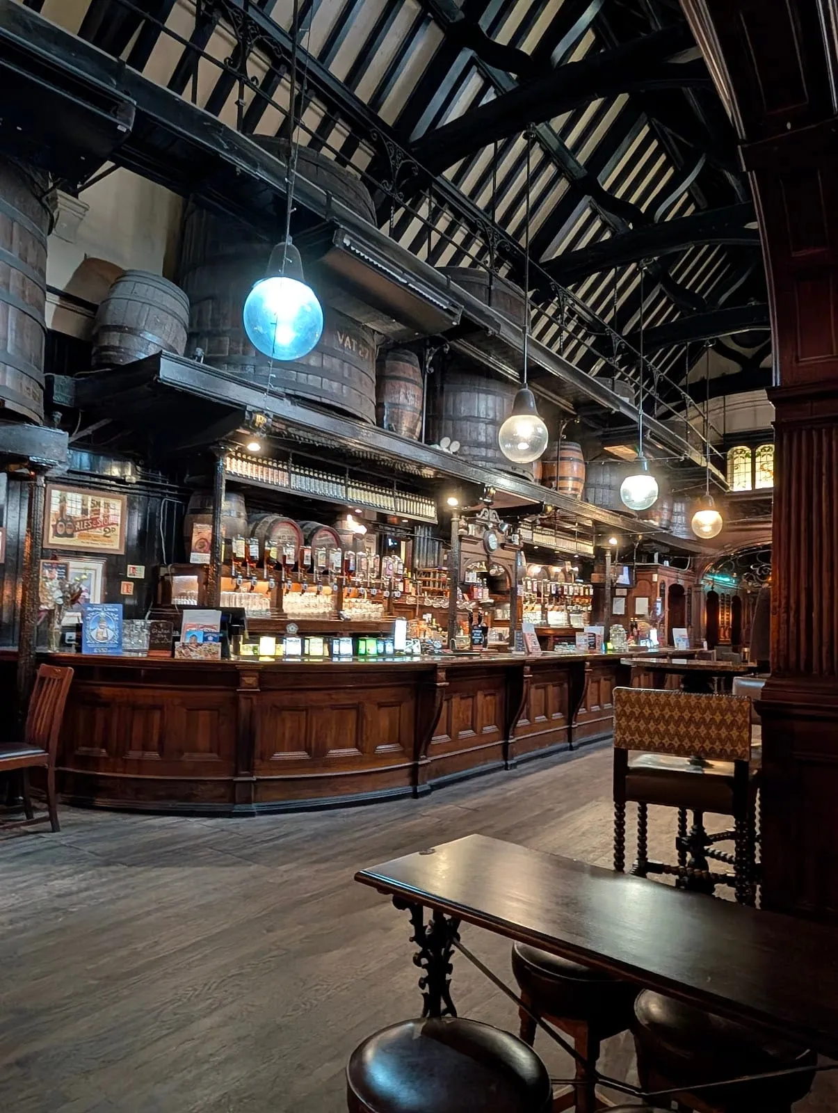 Cittie of Yorke's cathedral-like back bar, with a vaulted roof, giant wooden vats on a high gallery and a long curved bar below