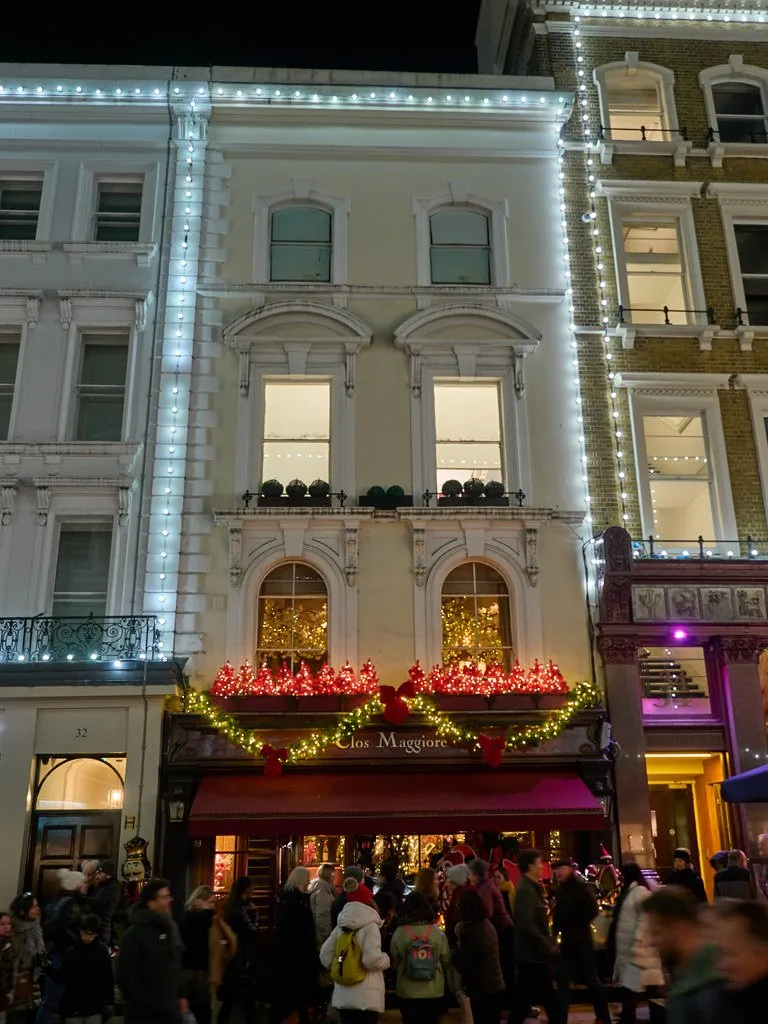 The frontage of Clos Maggiore in Covent Garden, lit and decorated