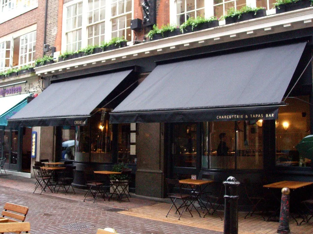 The awnings and pavement seating of Dehesa on Ganton Street