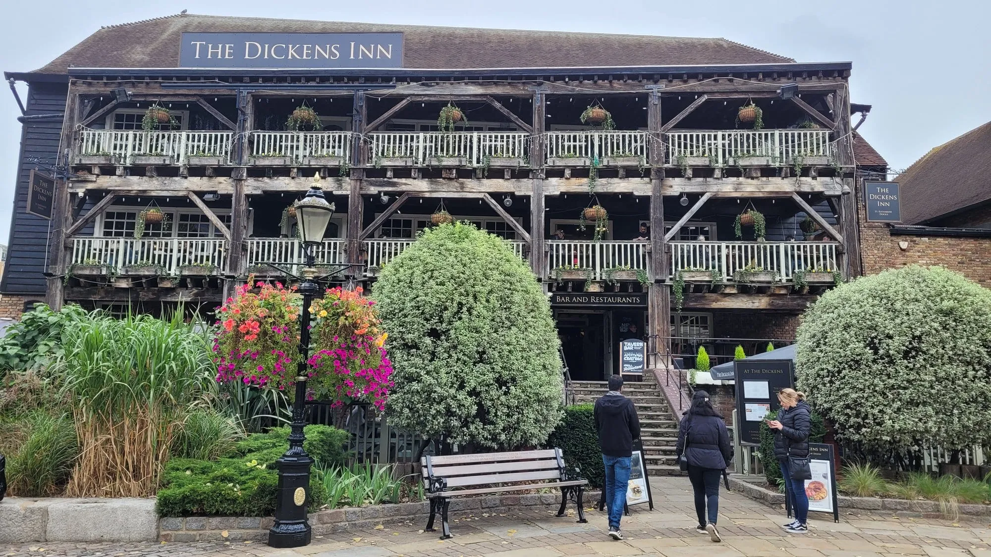 The Dickens Inn, a three-storey timber-framed pub with balconies over St Katharine Docks marina