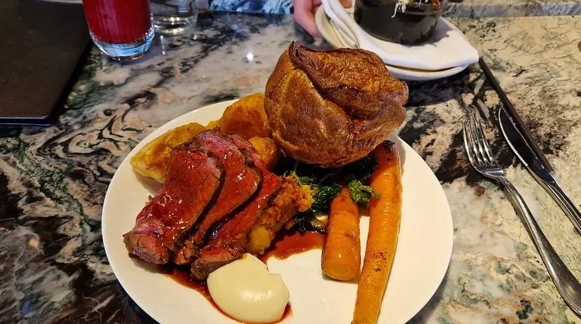 A roast at Fallow: sliced pink beef, a tall Yorkshire pudding, roast carrots and gravy