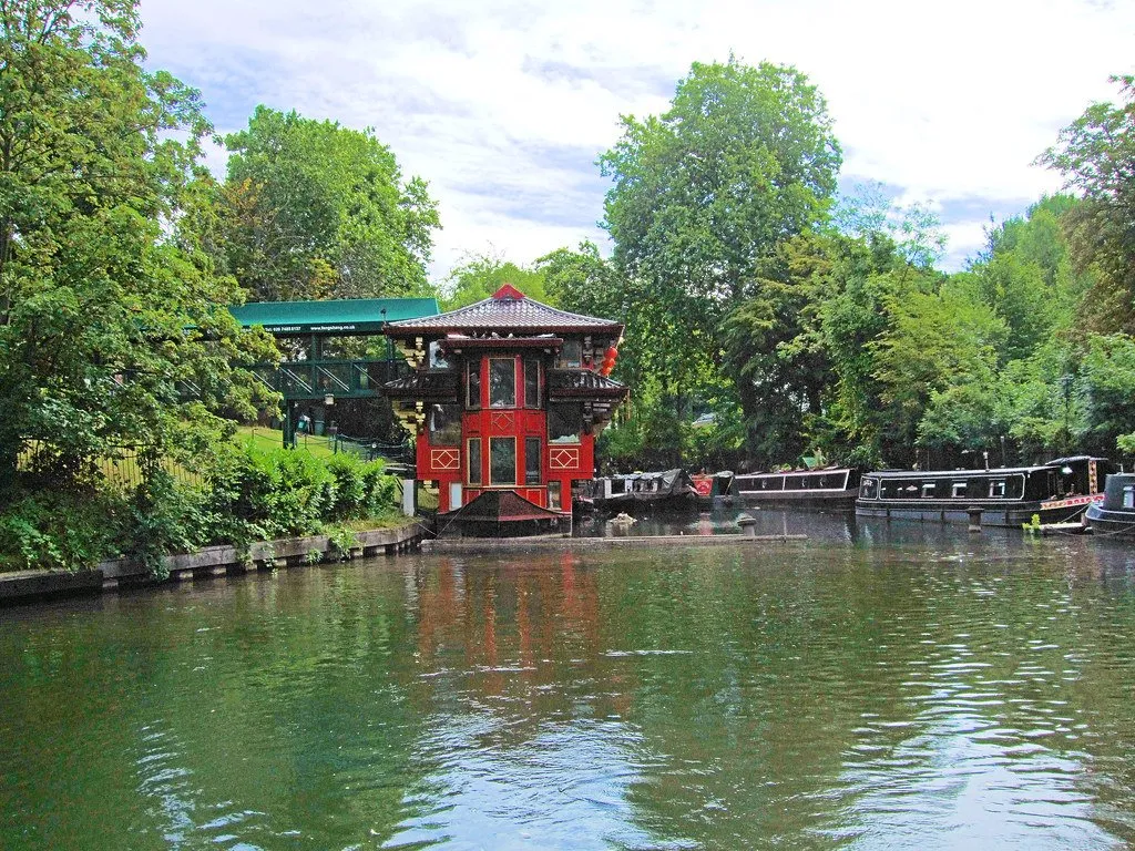 A red floating Chinese pagoda restaurant moored on Regent's Canal