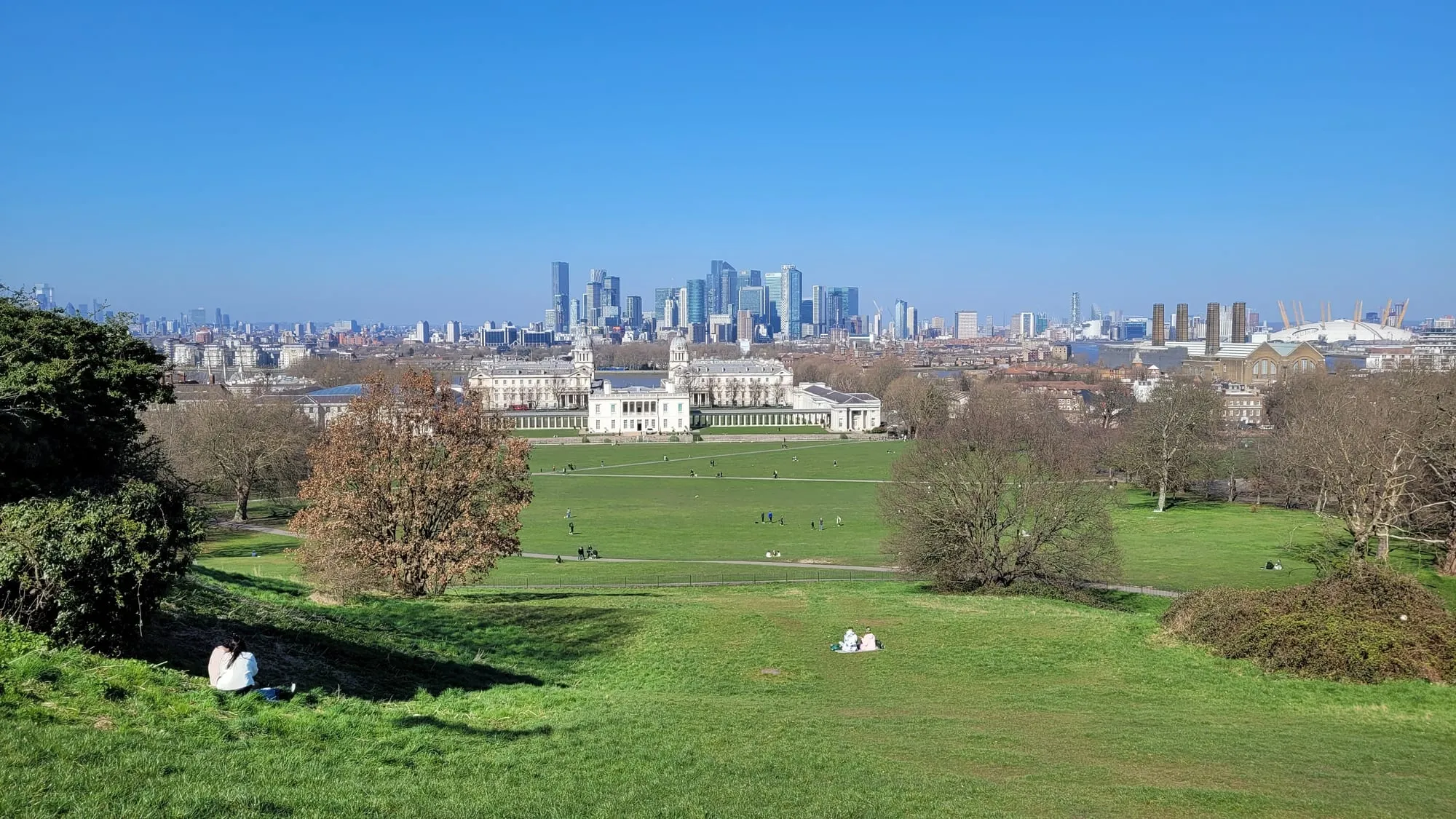 The view from Greenwich Park over the Old Royal Naval College to Canary Wharf and the City