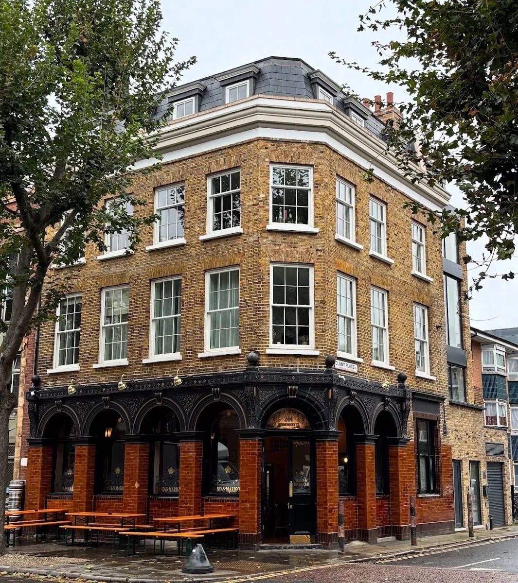 Hand & Marigold's corner frontage on Bermondsey Street, with orange picnic benches outside