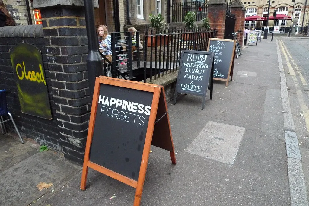 A pavement A-board outside Happiness Forgets in Hoxton Square