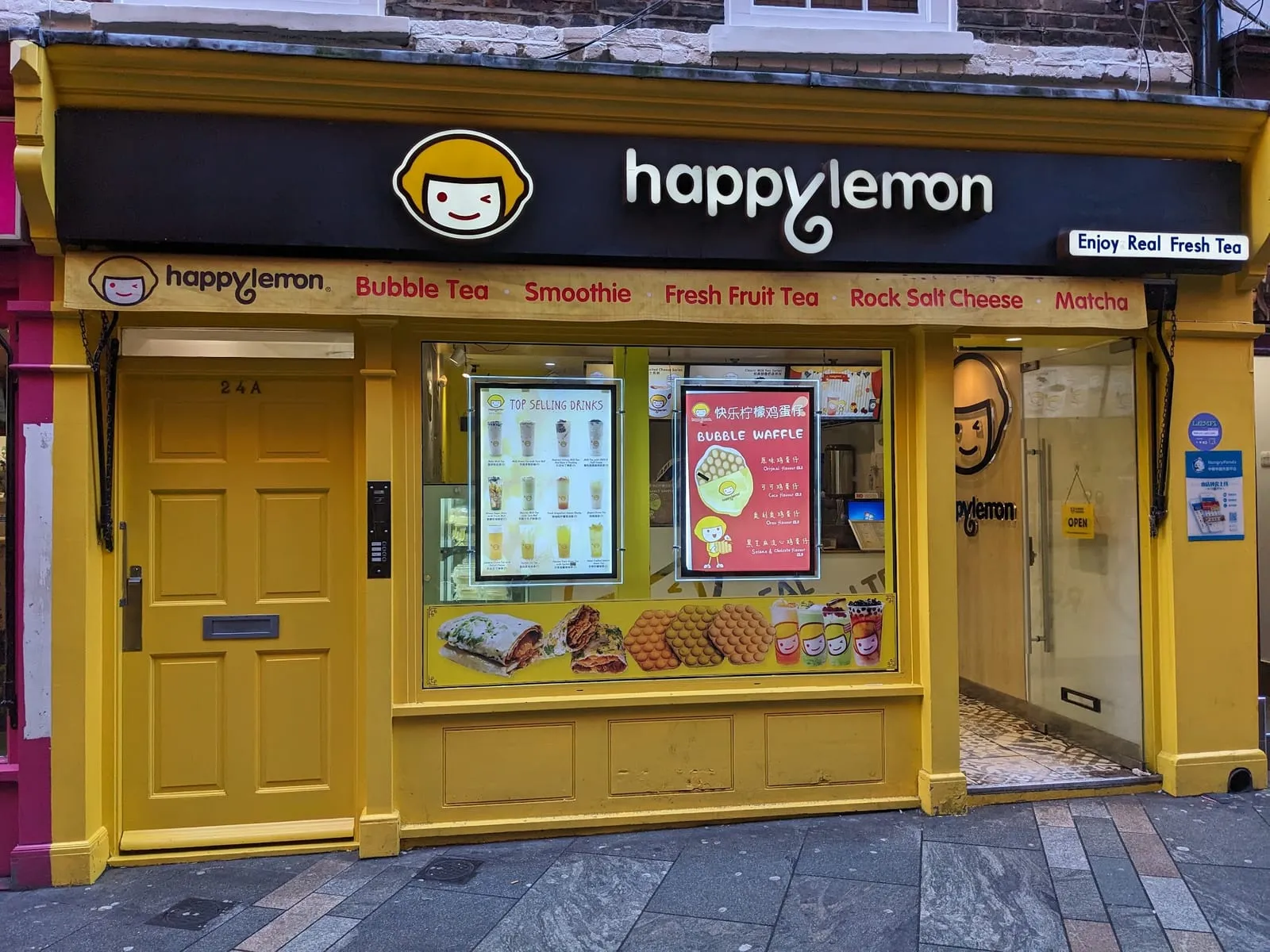 Happy Lemon's bright yellow shopfront at 24A Newport Court, with Bubble Tea, Fresh Fruit Tea and Rock Salt Cheese painted along the fascia