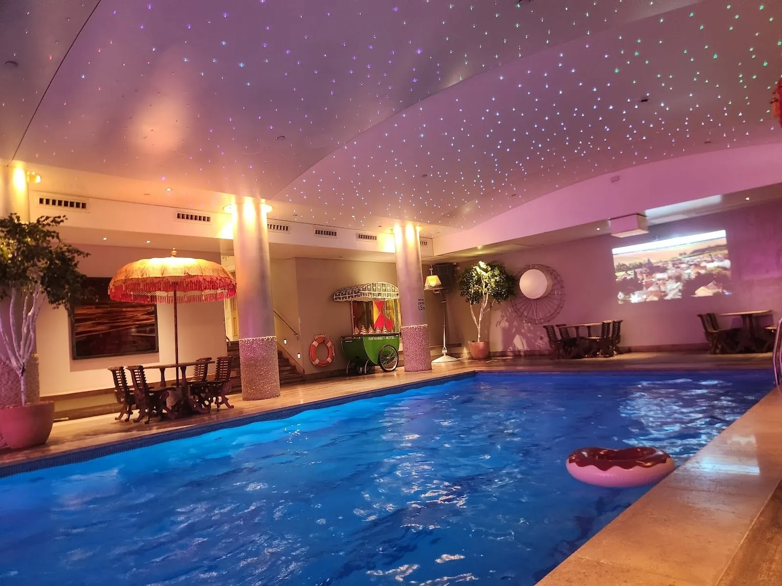 The underground pool at Haymarket Hotel, under a ceiling of fibre-optic lights