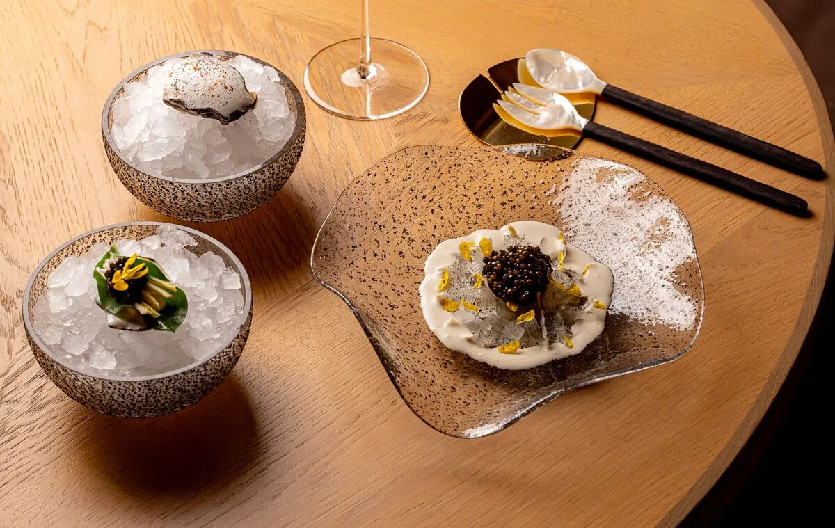 A caviar course served over crushed ice at Hélène Darroze at The Connaught