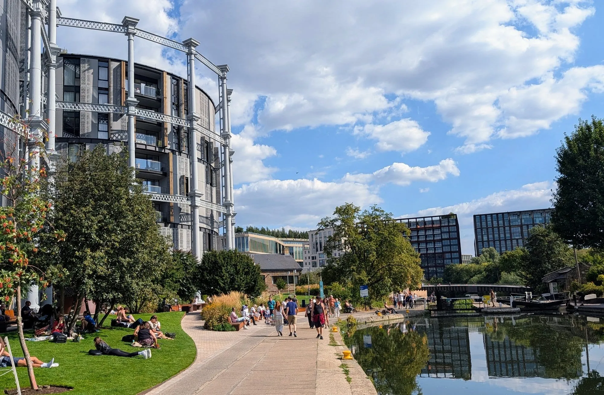 Gasholders London, a circular apartment building built inside a restored Victorian gasholder frame, seen from the Regent's Canal towpath