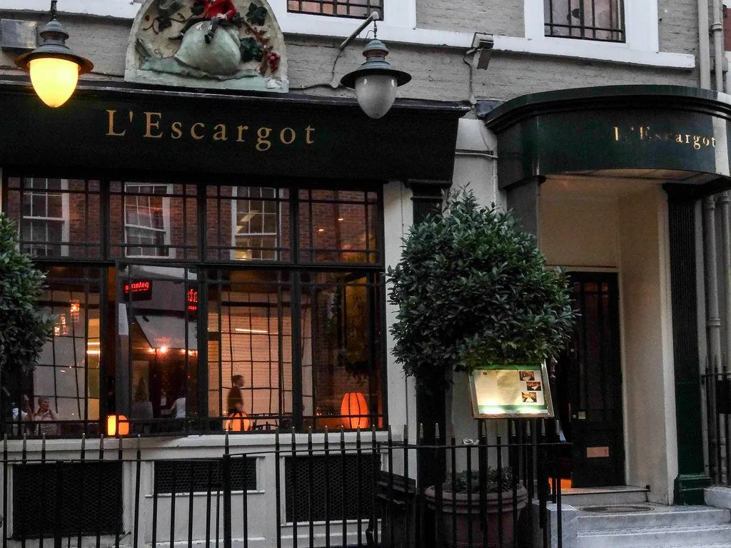 The green awnings and frontage of L'Escargot on Greek Street