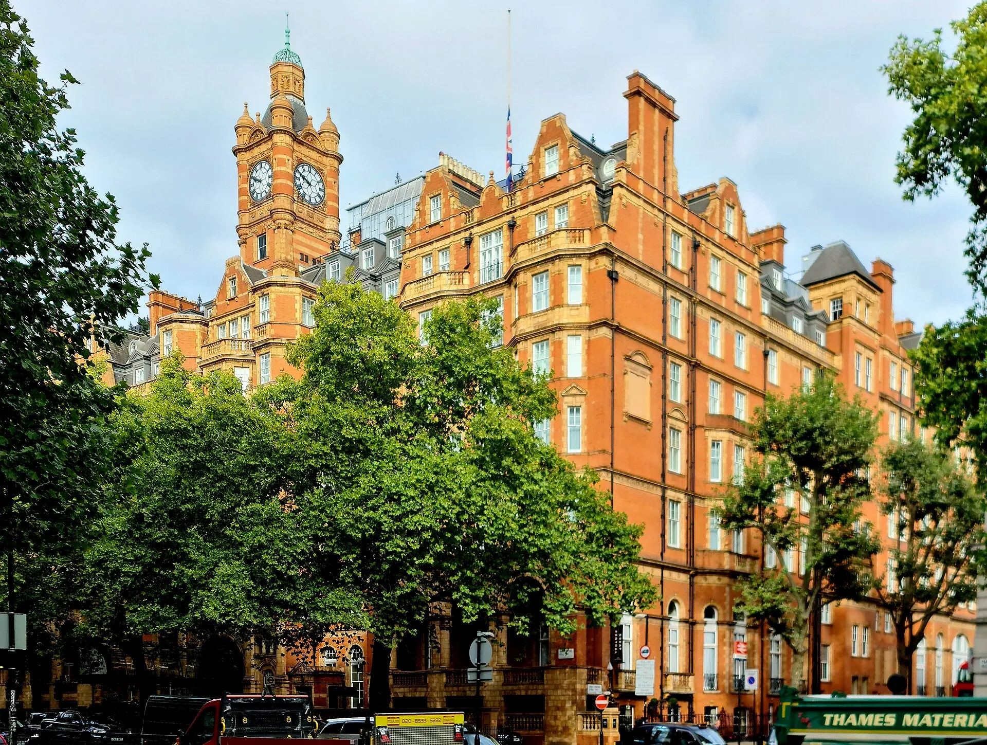 The Landmark London's red-brick Victorian frontage and clock tower on Marylebone Road, behind street trees