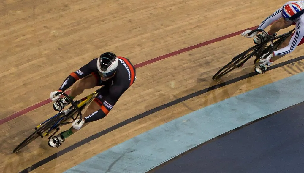 A track cyclist banking high on the wooden boards of the Lee Valley VeloPark velodrome