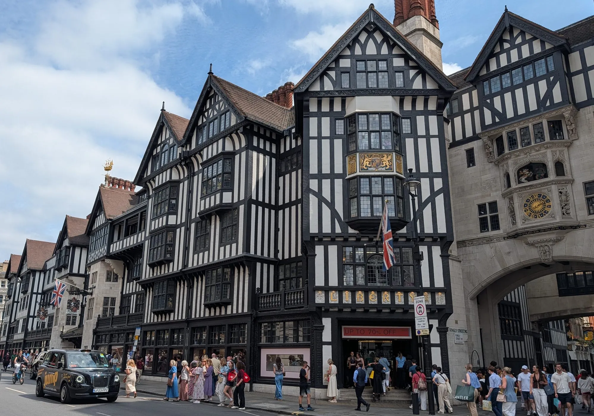 The mock-Tudor facade of Liberty on Great Marlborough Street, with shoppers outside the entrance