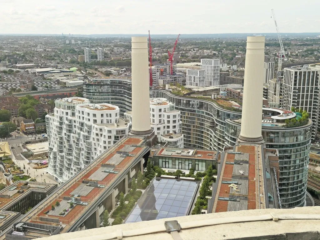 The view from the top of a Battersea Power Station chimney, looking down over the development and out across south London