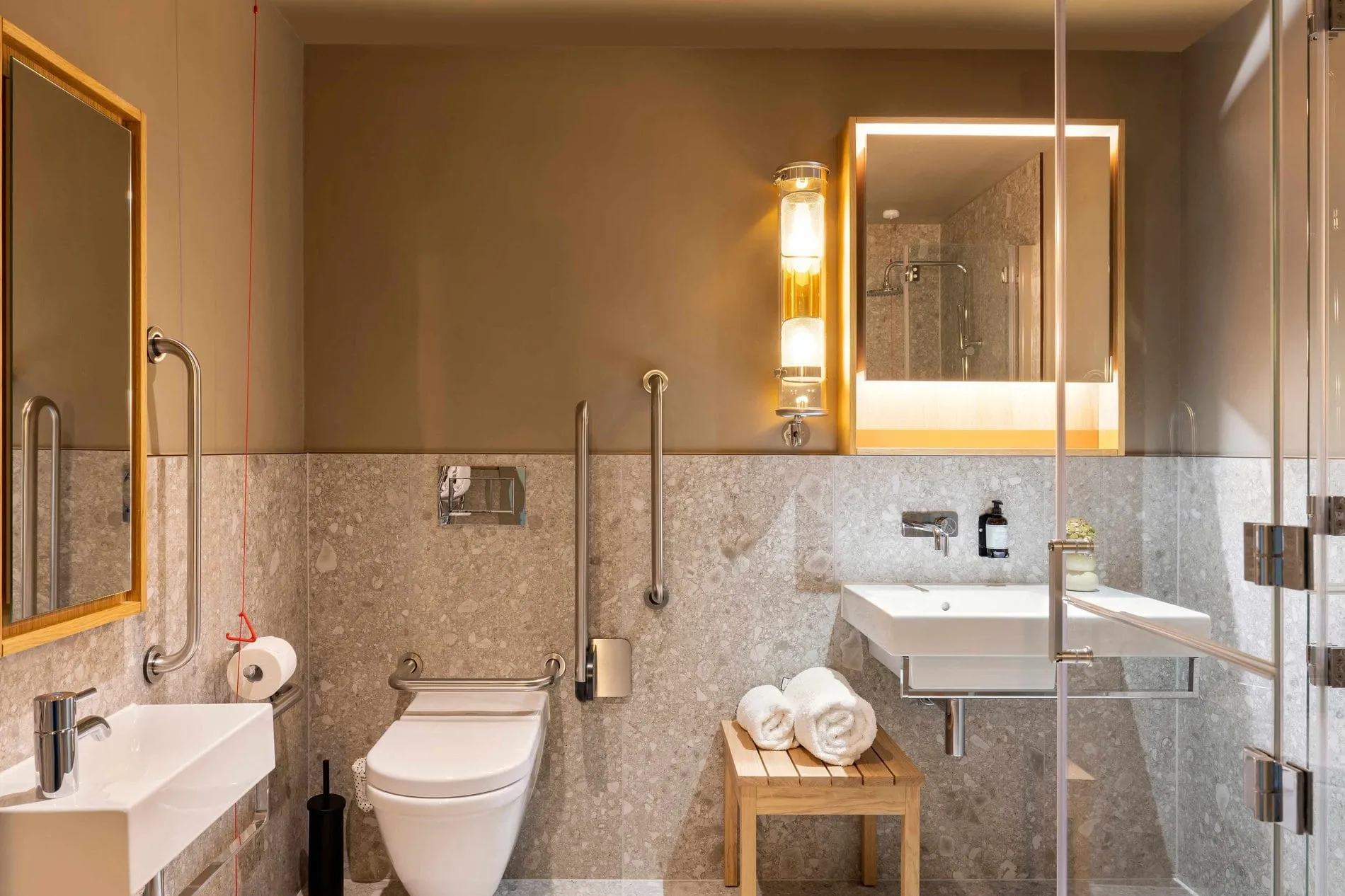 A bathroom at Locke at Broken Wharf with a walk-in shower and a floating sink