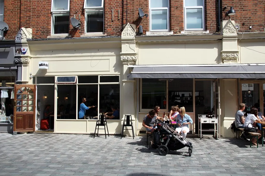 The frontage of Milk café in Balham with pavement tables