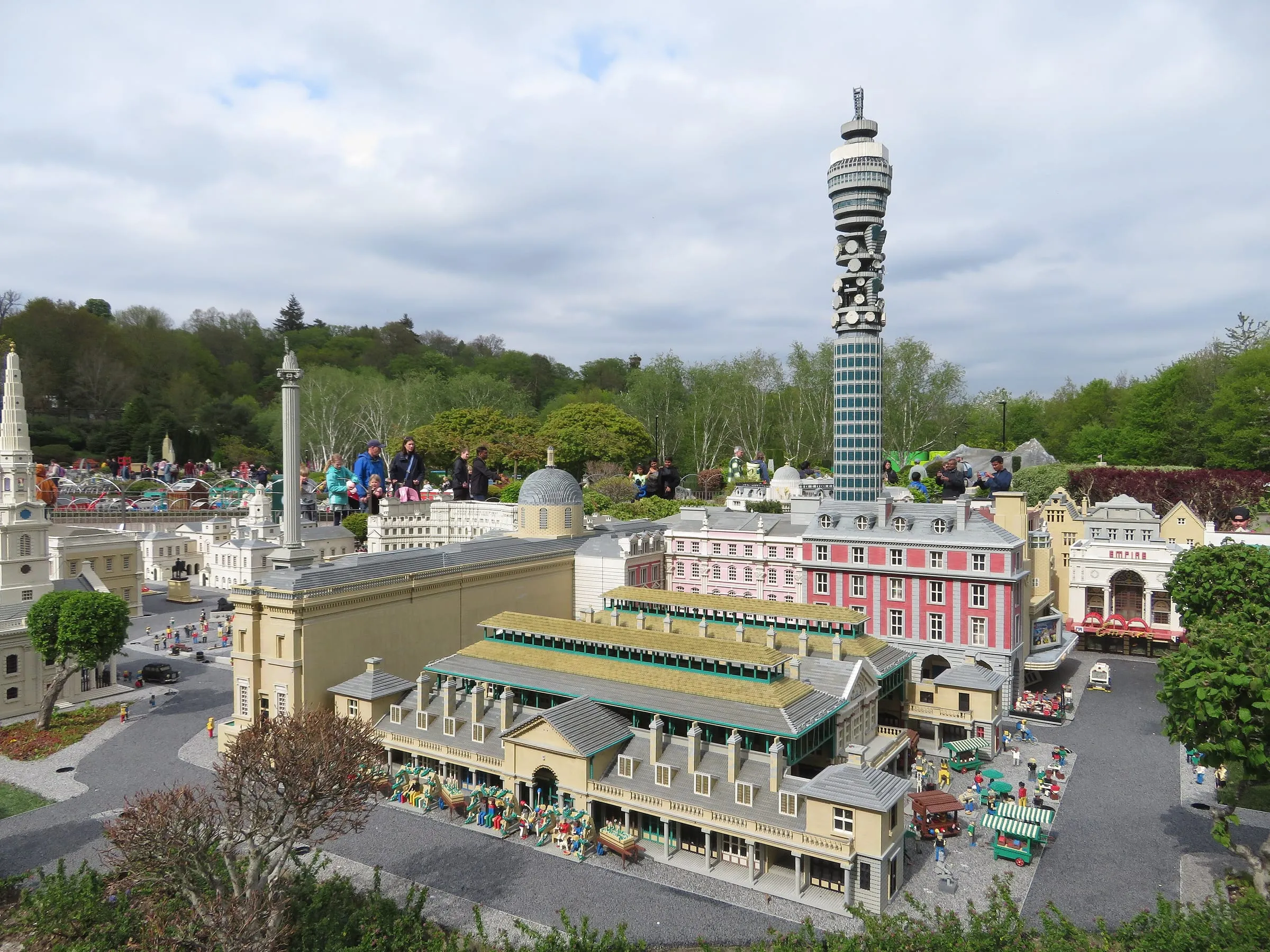 London built in LEGO bricks in Miniland at LEGOLAND Windsor, with the BT Tower rising over rows of model buildings and visitors watching from the path behind