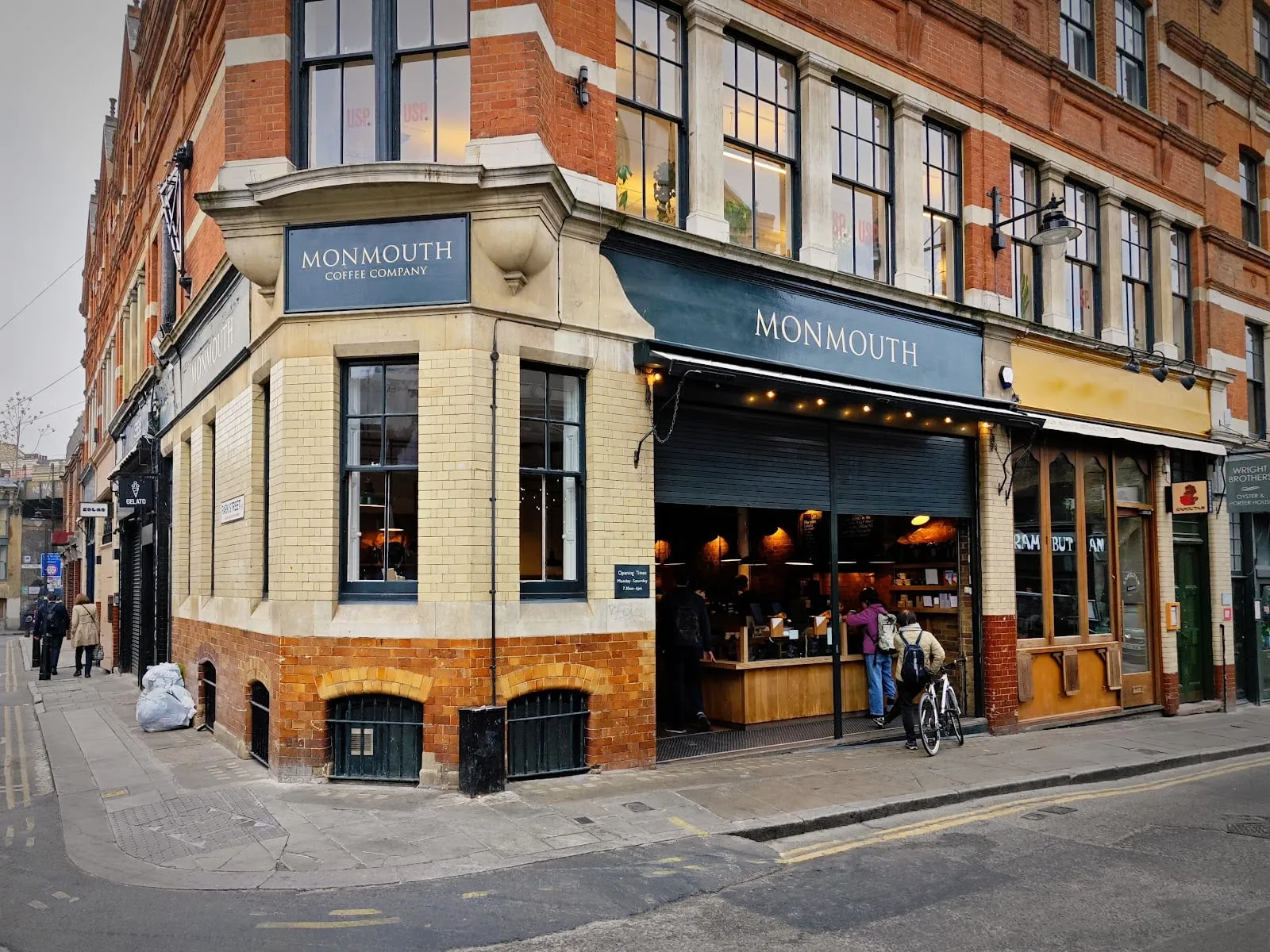 The corner shopfront of Monmouth Coffee Company on Park Street, with "MONMOUTH" painted above the open frontage