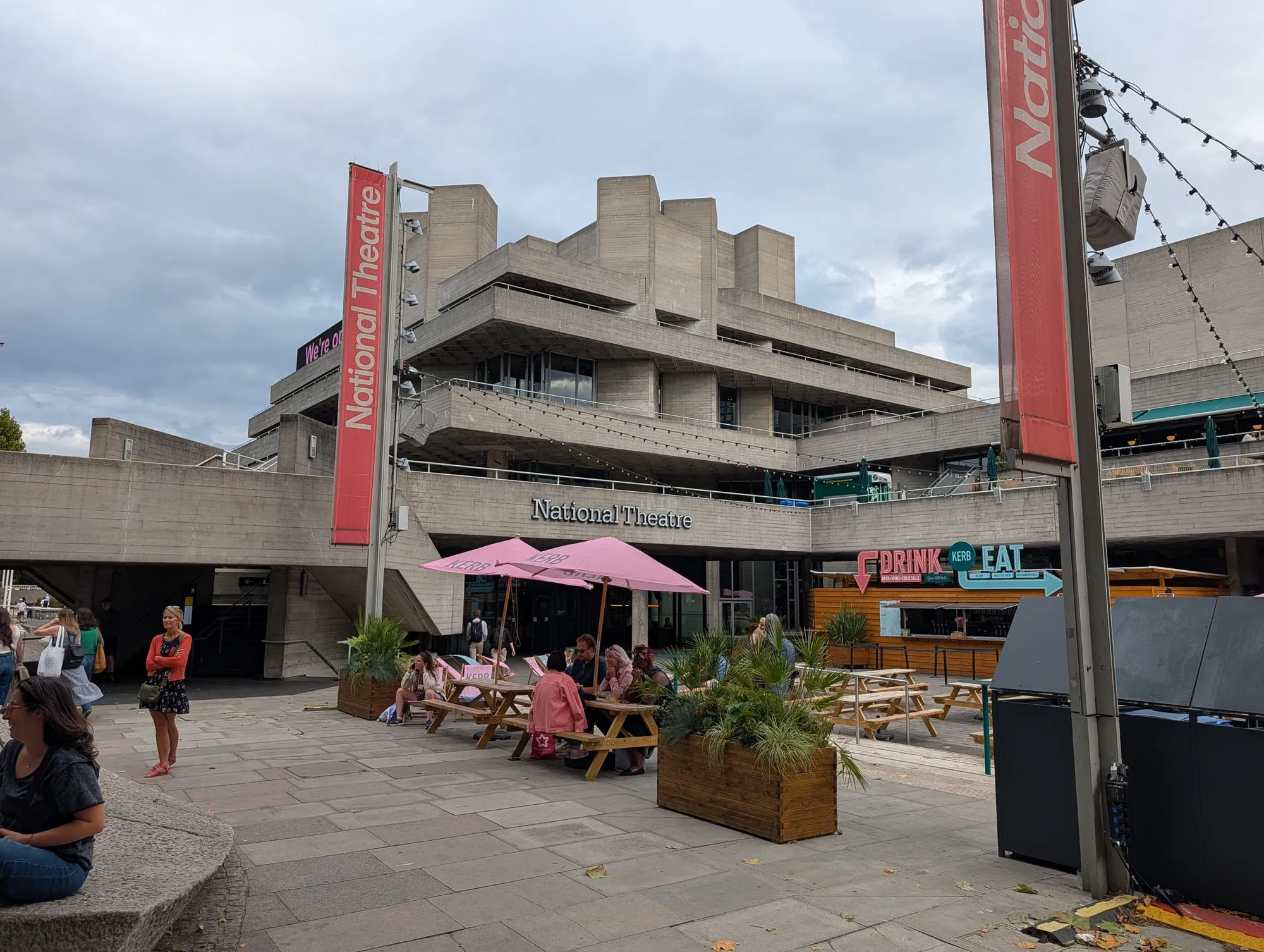 The stacked concrete terraces of the National Theatre, with picnic tables and food kiosks on the terrace below