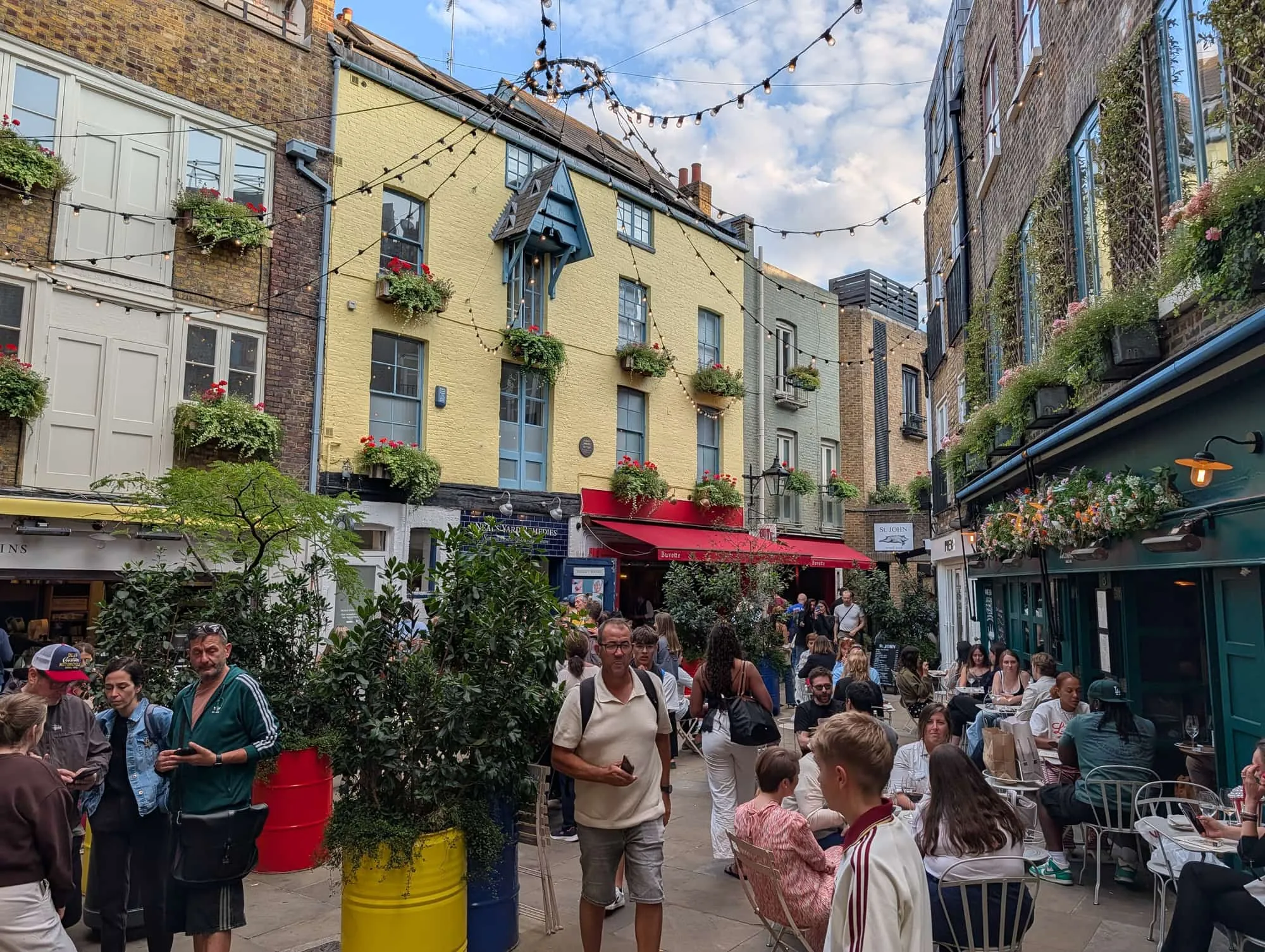 The brightly painted buildings and packed outdoor tables of Neal's Yard