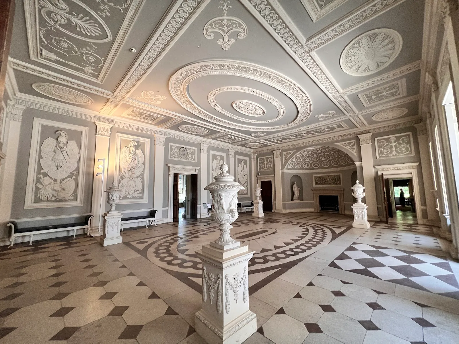 The Entrance Hall at Osterley Park House, a patterned stone floor beneath a grey and white plasterwork ceiling