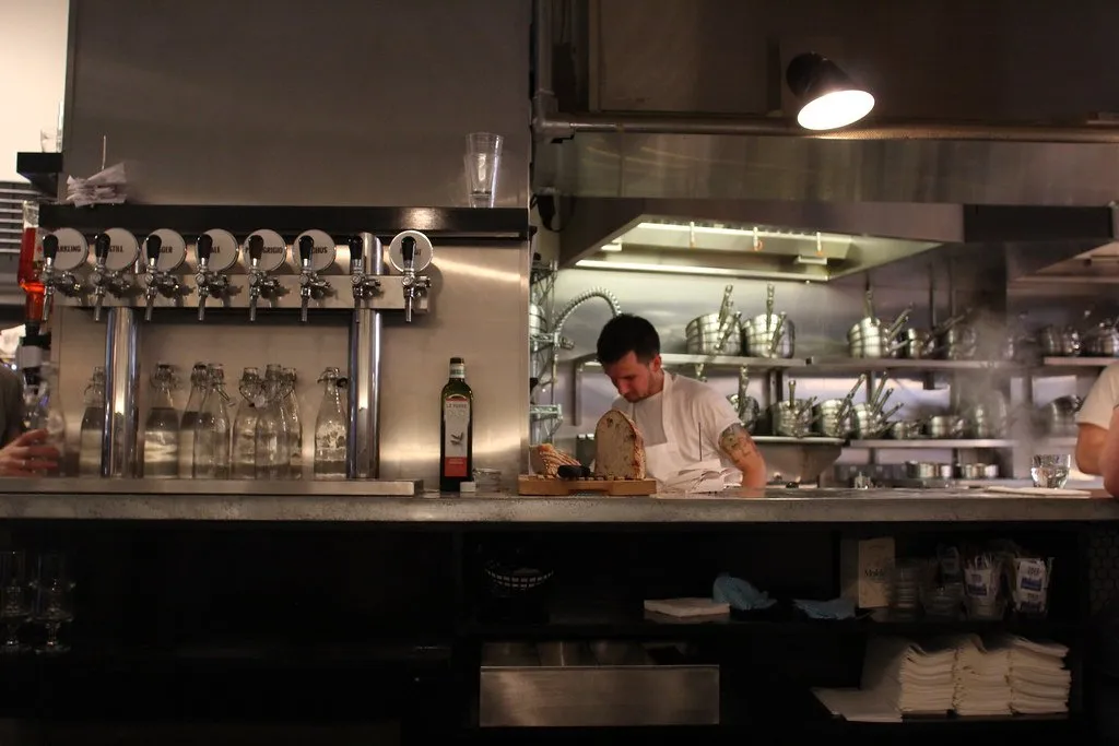 The interior counter of Padella with cooks working behind it