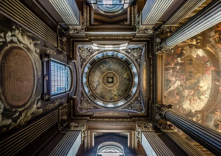 Looking straight up at the ornate painted dome ceiling of the Painted Hall in the Old Royal Naval College