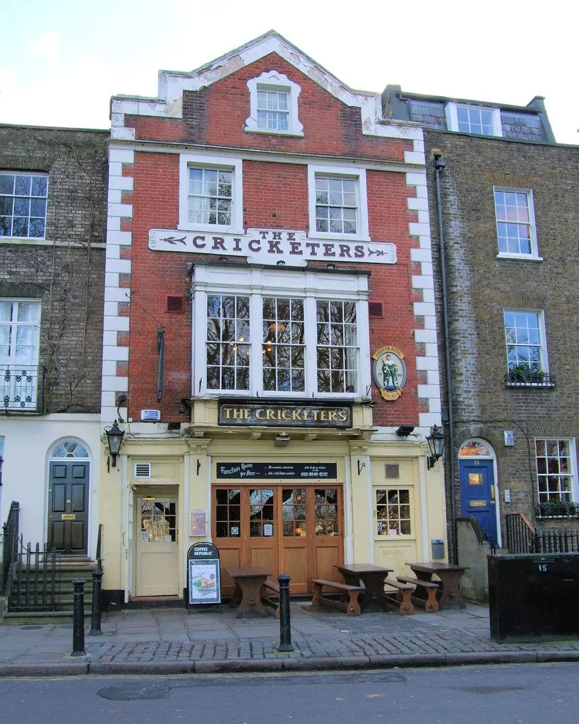 The red brick frontage of The Cricketers pub on Richmond Green