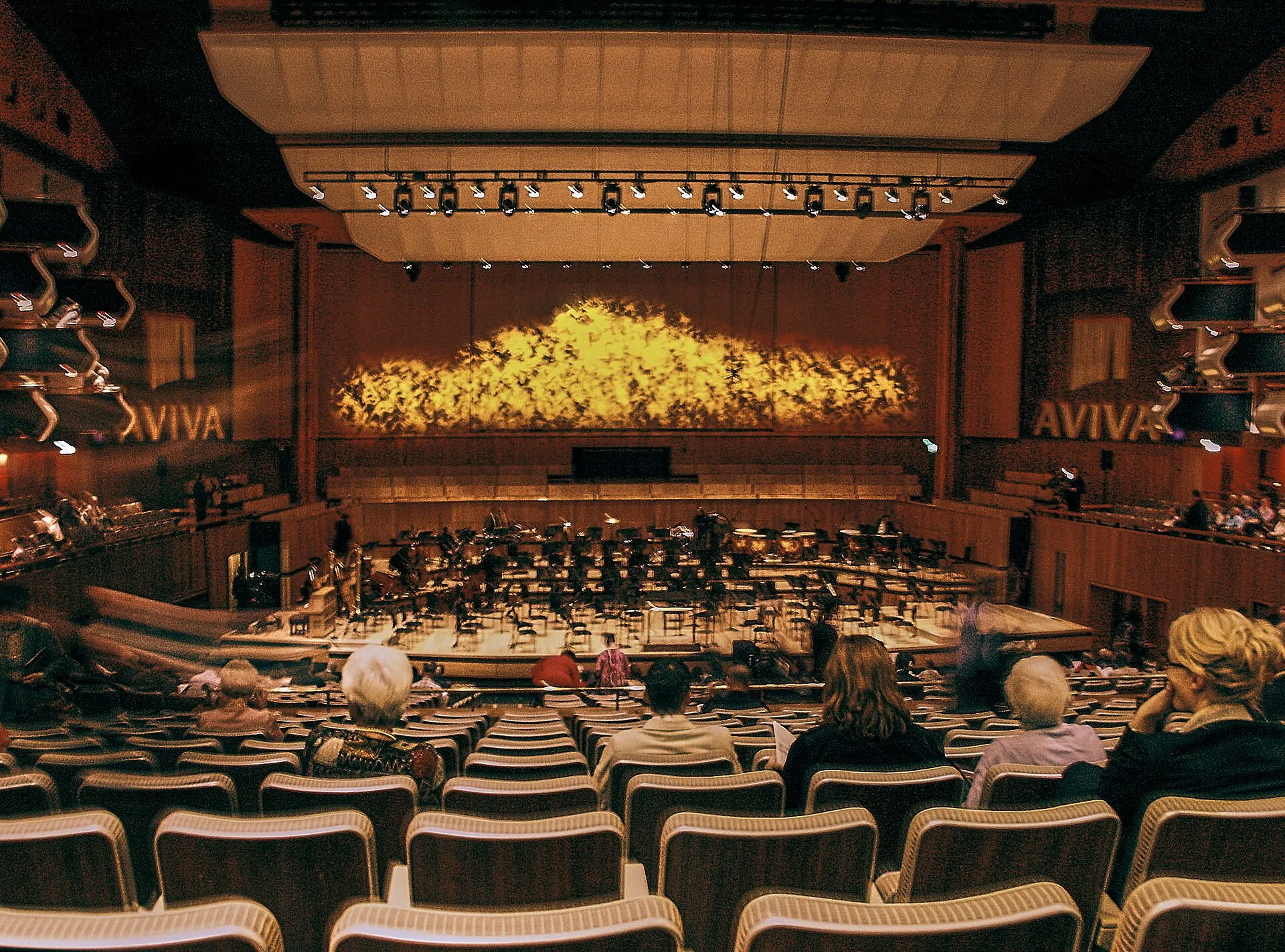 The auditorium of the Royal Festival Hall from the rear stalls, tiers of seating curving round towards the stage