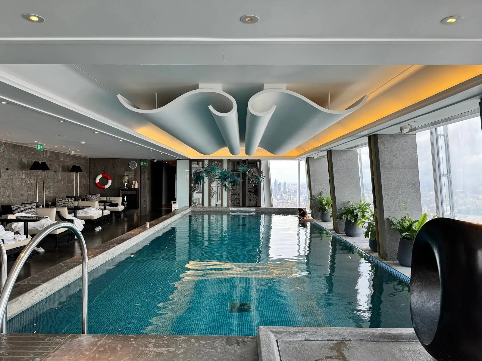 The Sky Pool at Shangri-La The Shard, with a curved ceiling feature and windows over the city