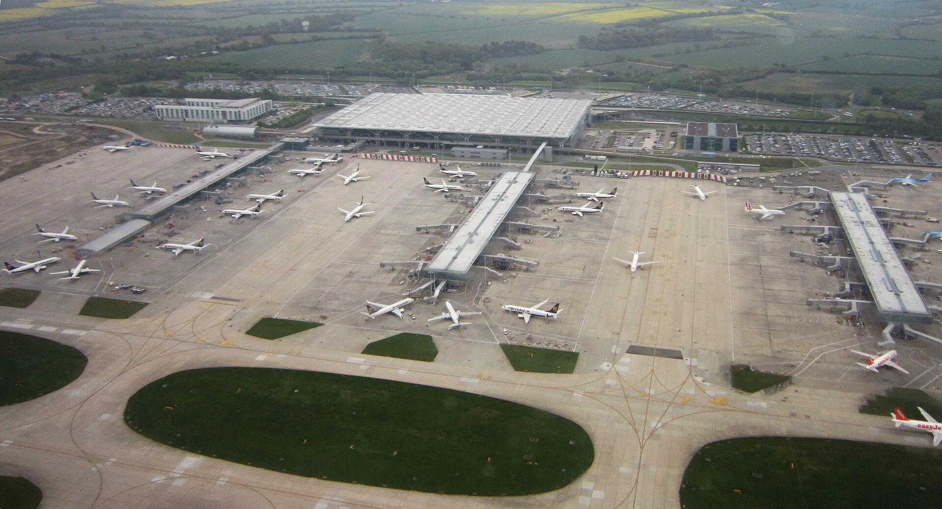 An aerial view of London Stansted Airport and its terminal satellites
