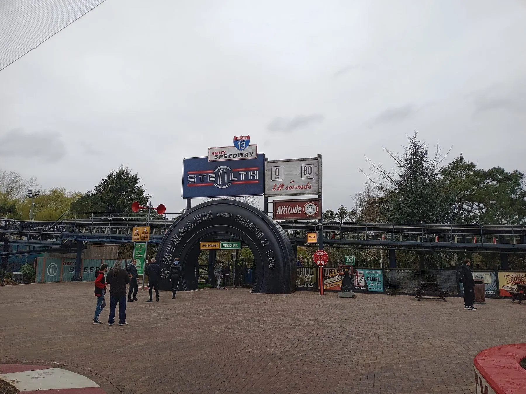 The entrance to Stealth at Thorpe Park, a giant black tyre arch under a sign reading 0 to 80 mph in 1.8 seconds