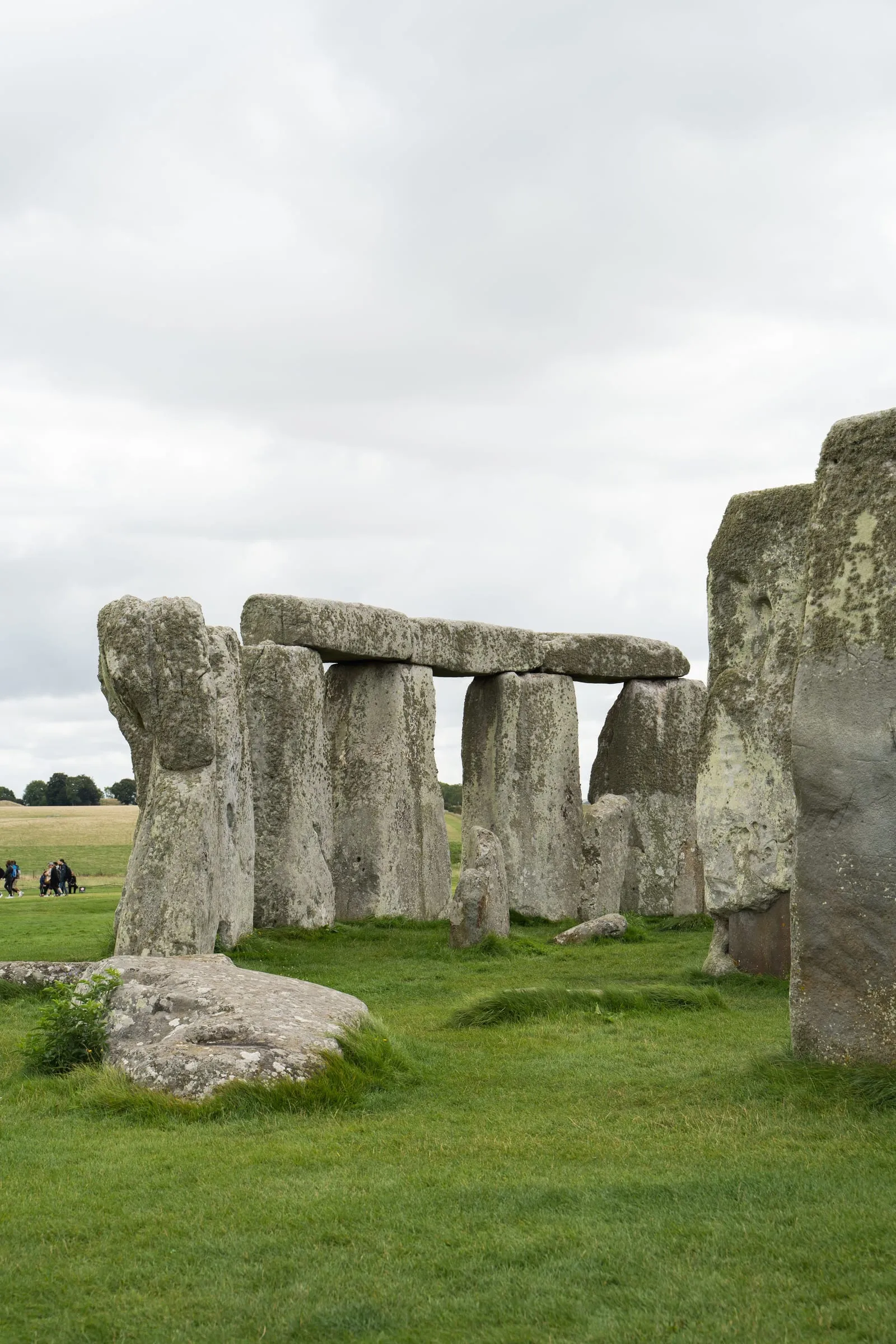 Close view of Stonehenge's sarsen trilithons, the lintels balanced on their uprights against the sky