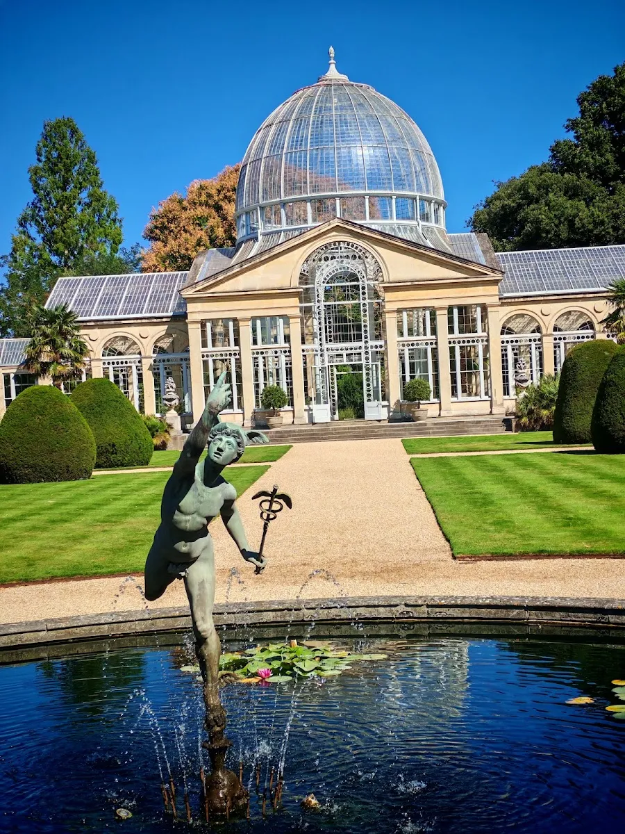 The domed glasshouse of the Great Conservatory at Syon Park, seen across a fountain pool with a statue of Mercury