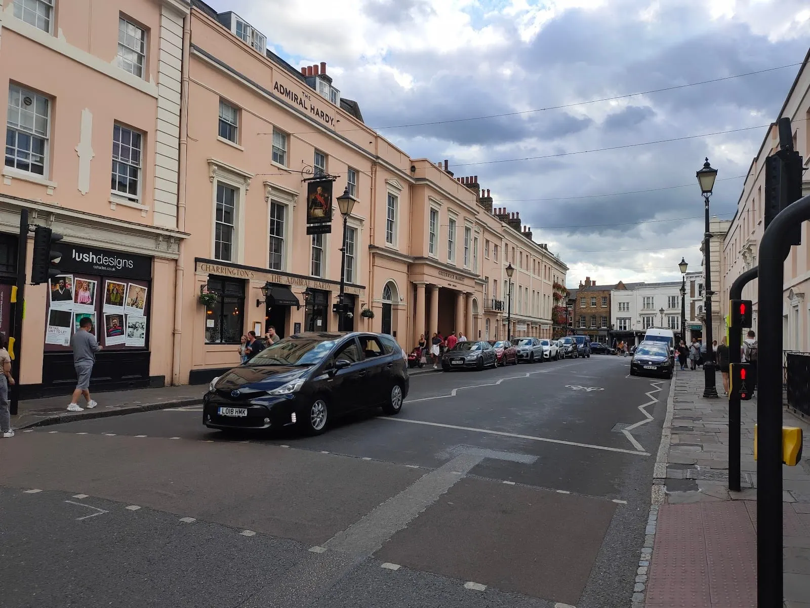 The Admiral Hardy on College Approach, with its hanging pub sign and the market entrance further along the street
