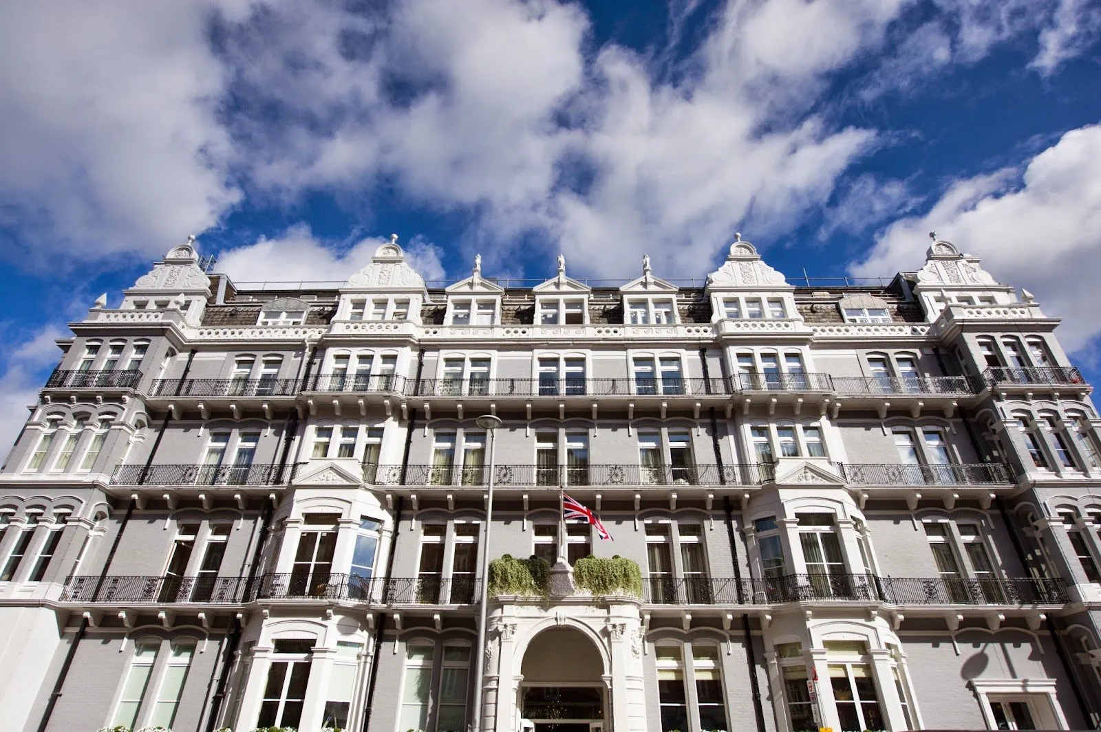 The Victorian white stone and brick facade of The Ampersand Hotel on Harrington Road with wrought-iron balconies