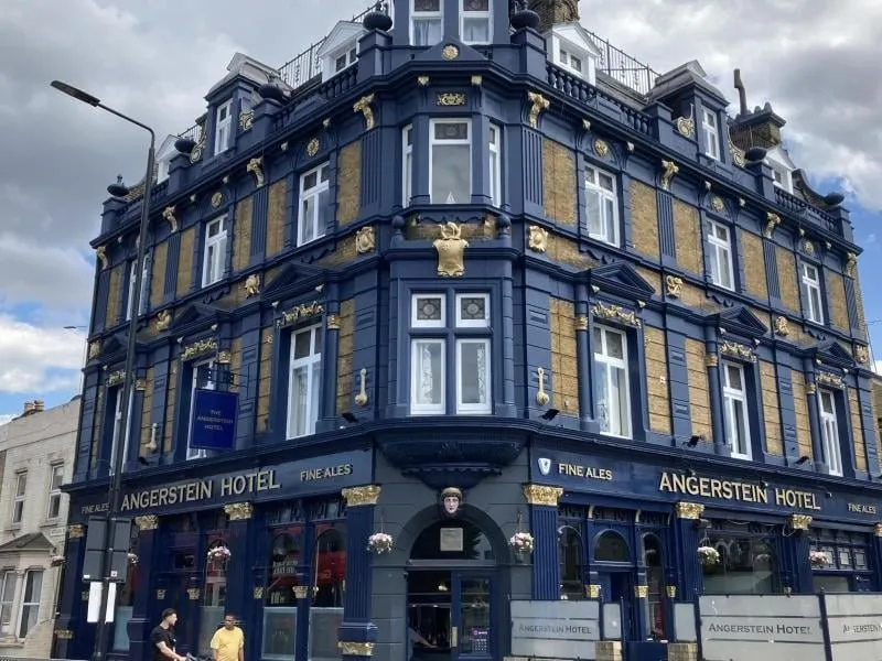 The Angerstein Hotel on Woolwich Road, a blue and gold Victorian corner pub