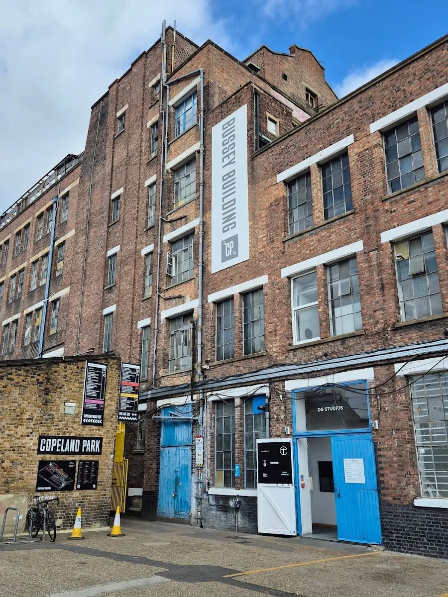 The brick exterior of the Bussey Building, with BUSSEY BUILDING and COPELAND PARK painted signs